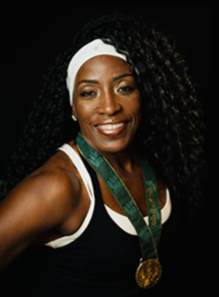 Ruthie Bolton wearing her Olympic gold medal